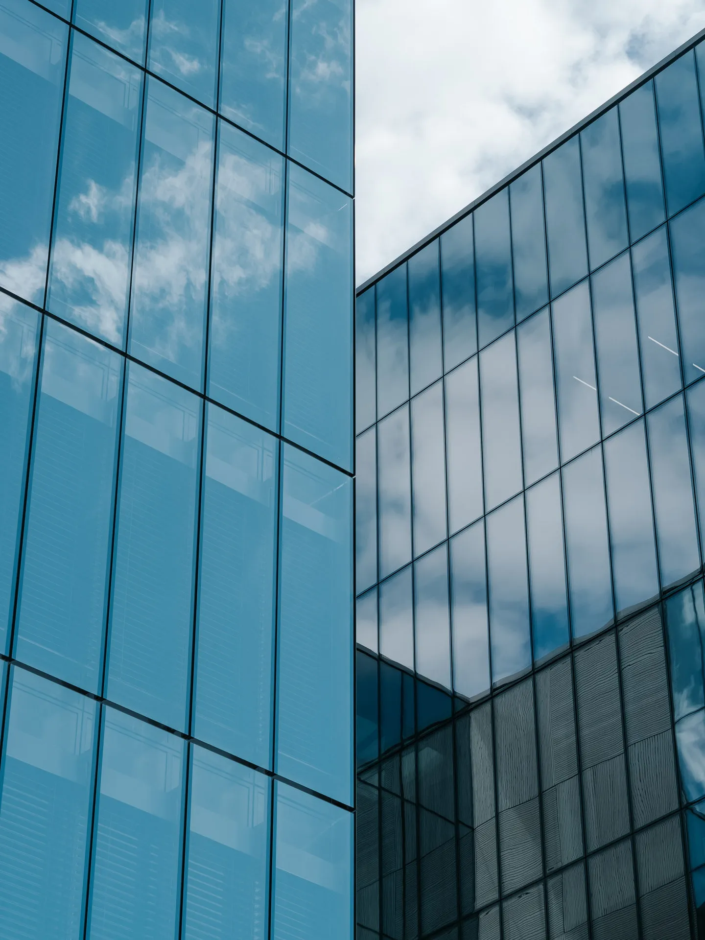 Glass office towers seen from below